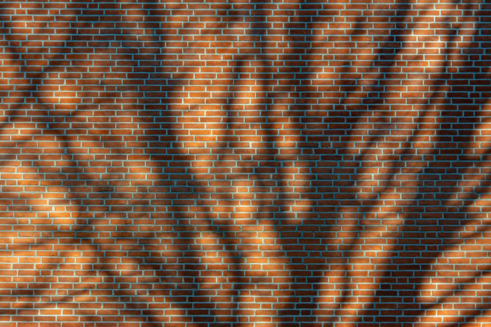 shadow patterns on brick wall texture