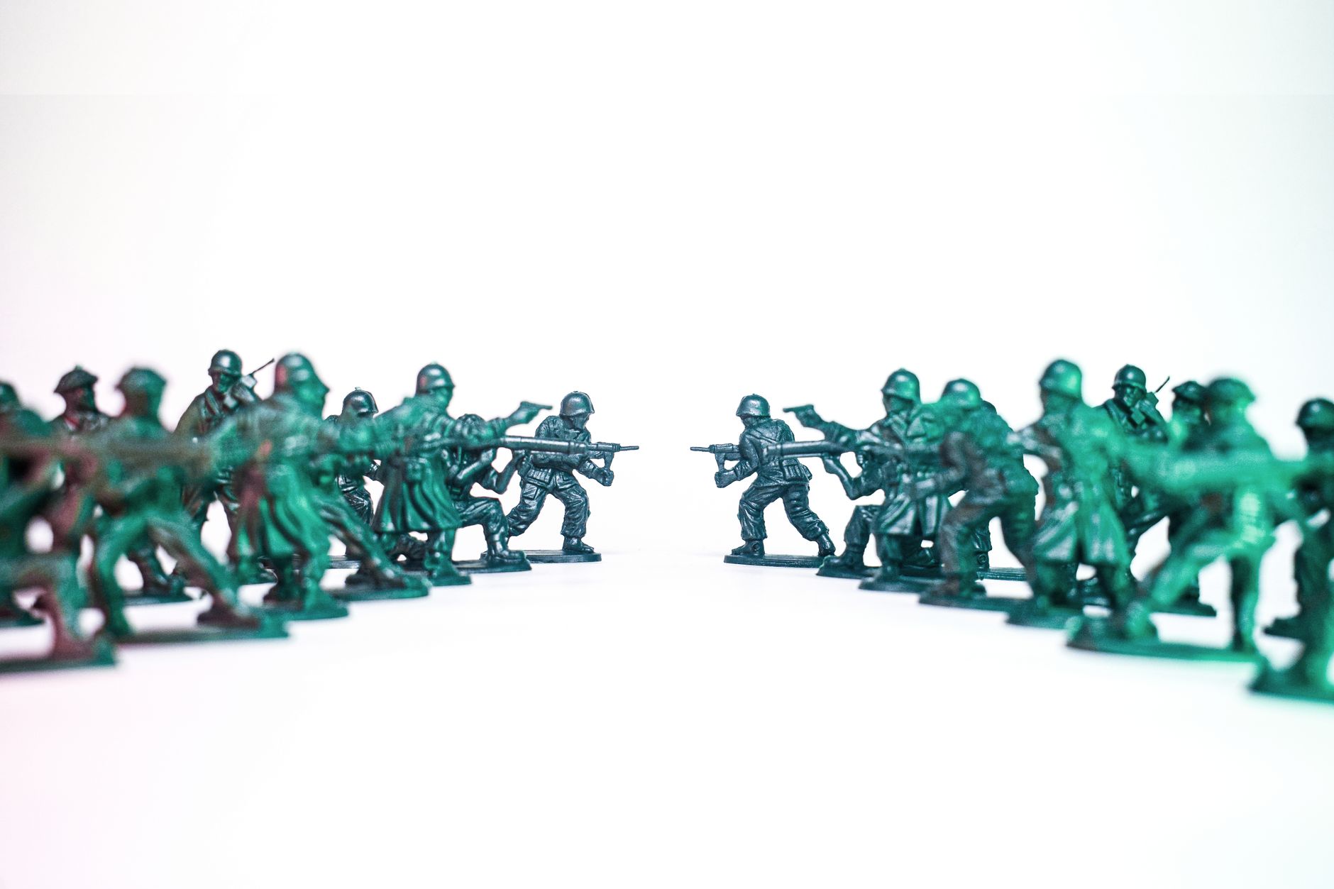 toy soldiers standoff on white background