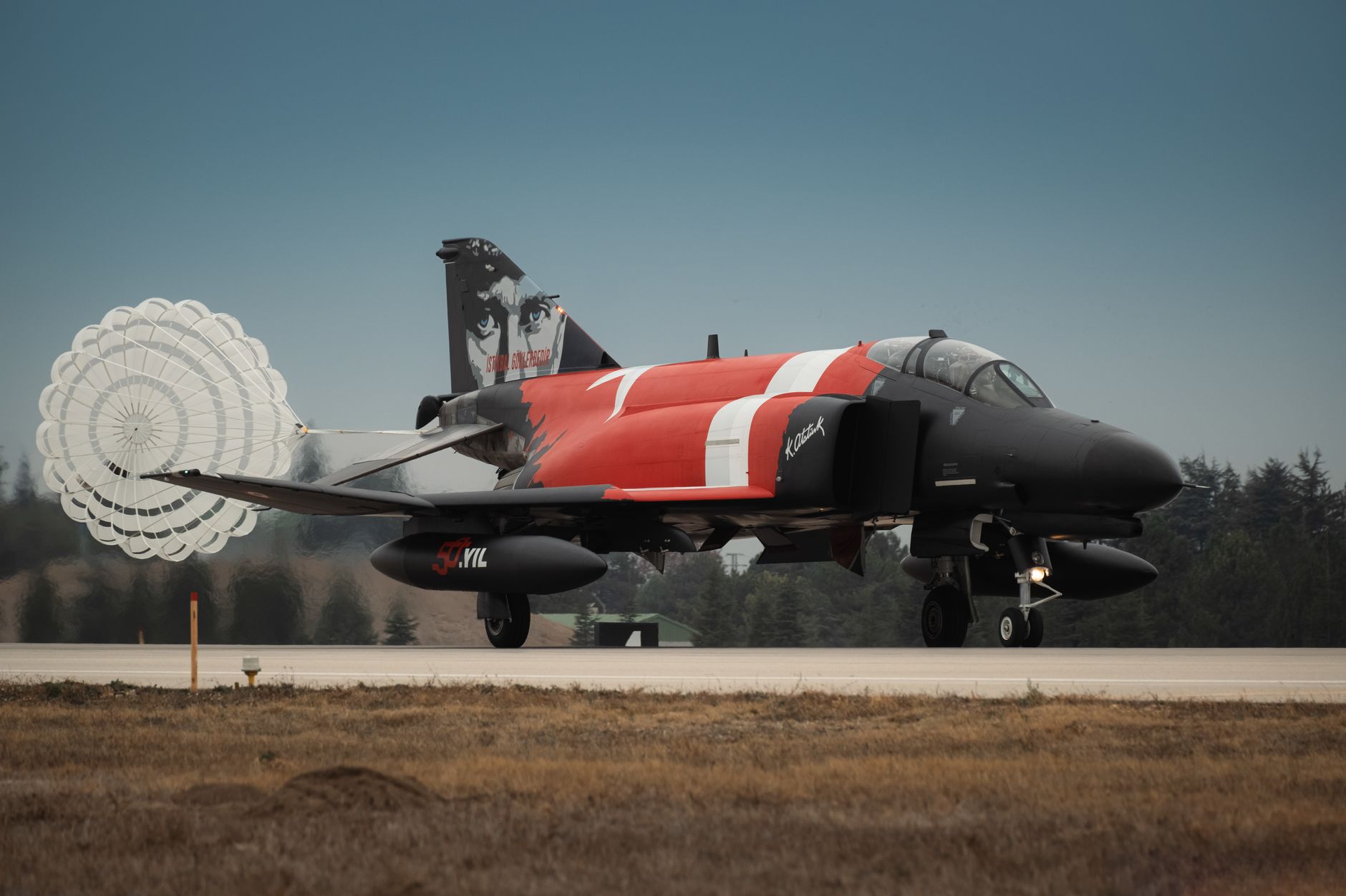 turkish air force jet with parachute landing