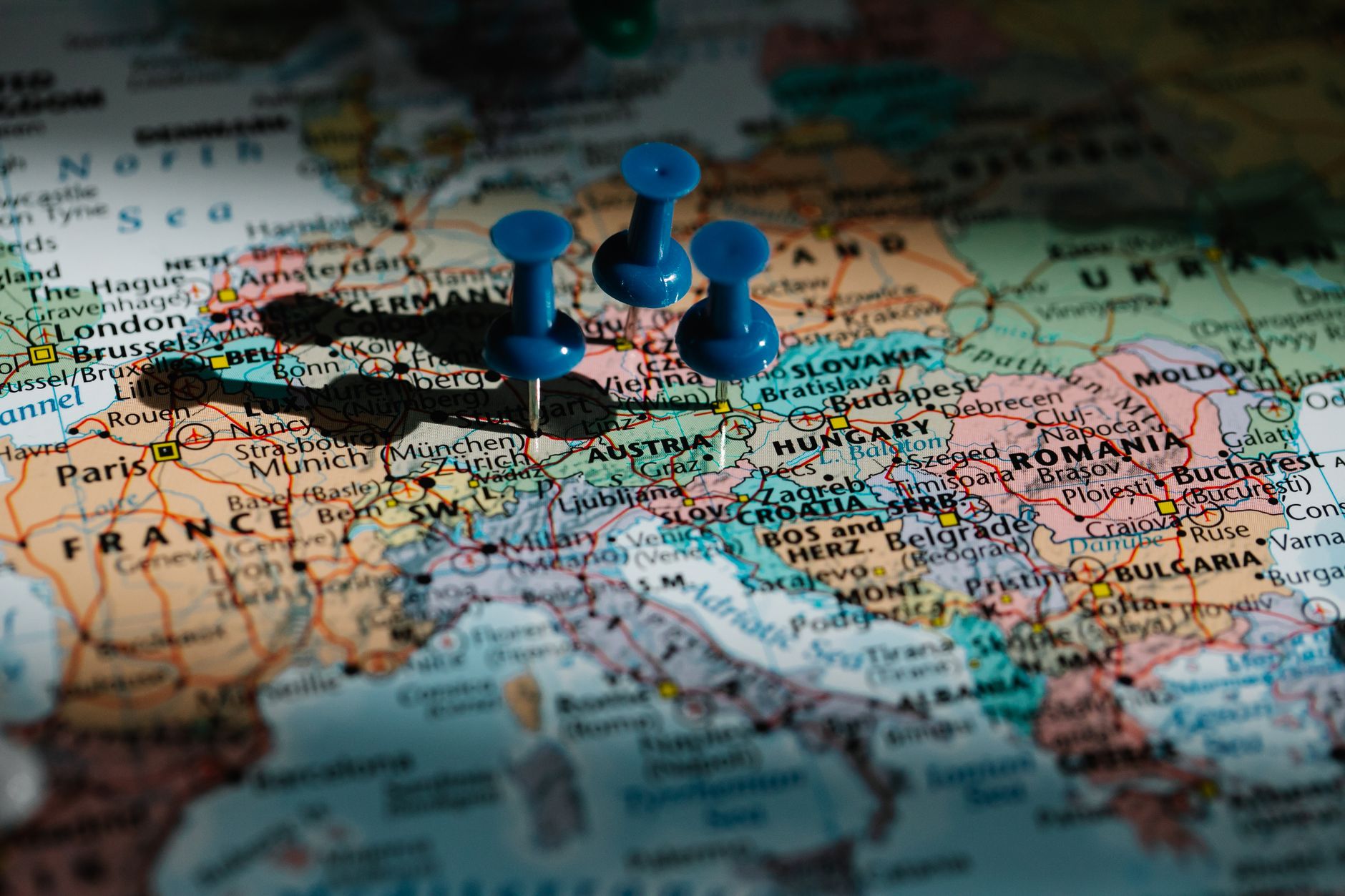 blue pushpins on administrative map of europe